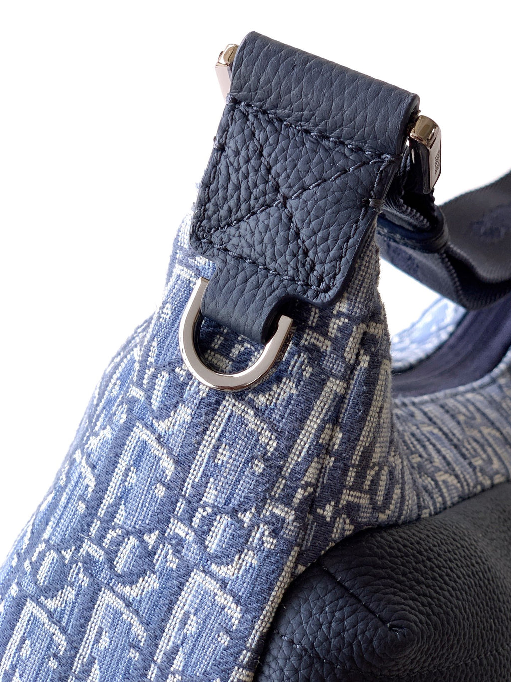 Dior blue monogram bag corner with ring hardware and adjustable shoulder strap