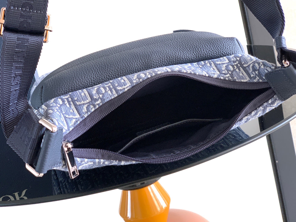 Dior blue monogram baguette bag with open top, zipper trim, interior view