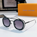 Louis Vuitton round sunglasses, black frames with purple lenses.