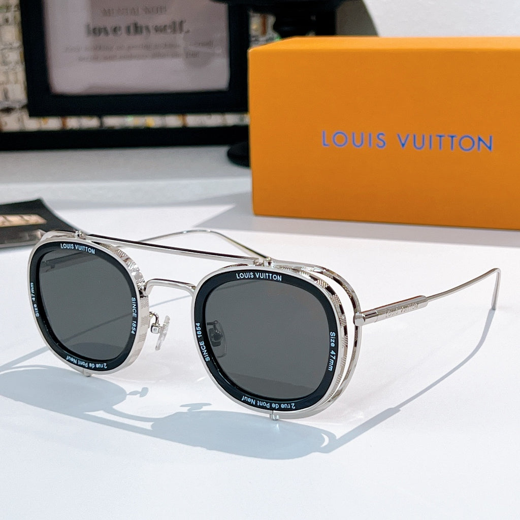 Louis Vuitton round sunglasses, silver frames with dark gray lenses.