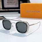 Louis Vuitton round sunglasses, silver frames with dark gray lenses.