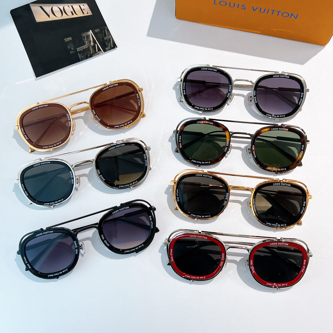 Sunglasses set on display with multiple frames and dark lenses; Louis Vuitton box in view.