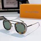 Louis Vuitton round sunglasses, silver frames with green and amber lenses.