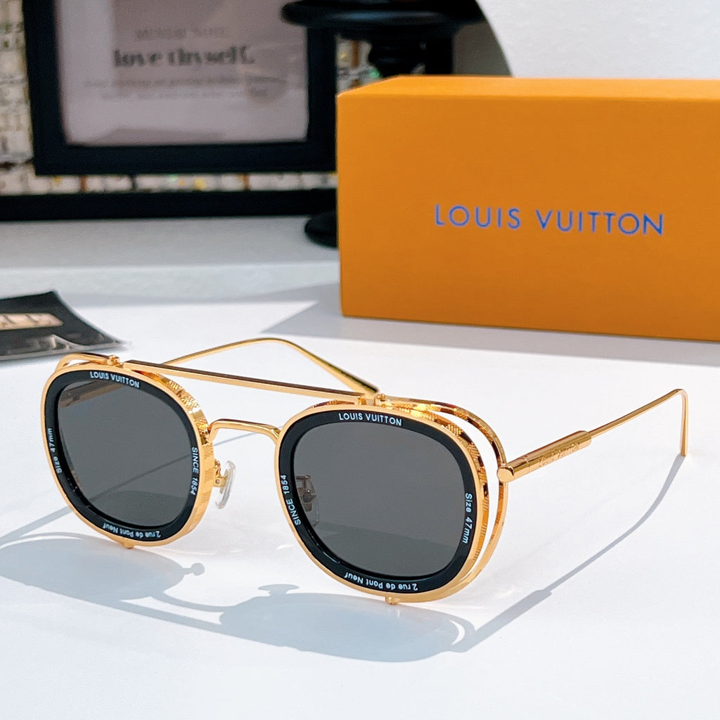 Louis Vuitton round sunglasses, gold frames with dark gray lenses.