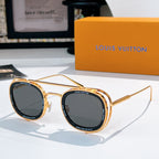 Louis Vuitton round sunglasses, gold frames with dark gray lenses.