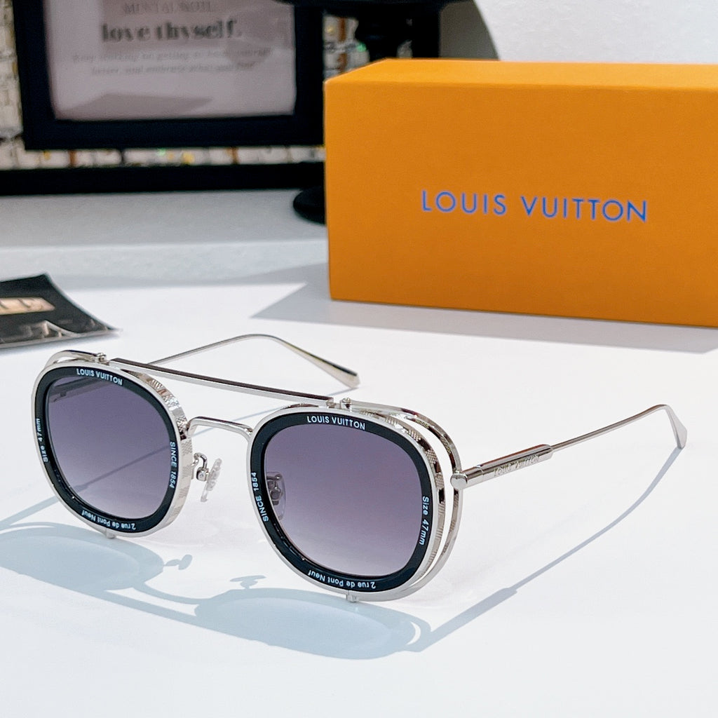 Louis Vuitton round sunglasses, silver frames with dark purple lenses.