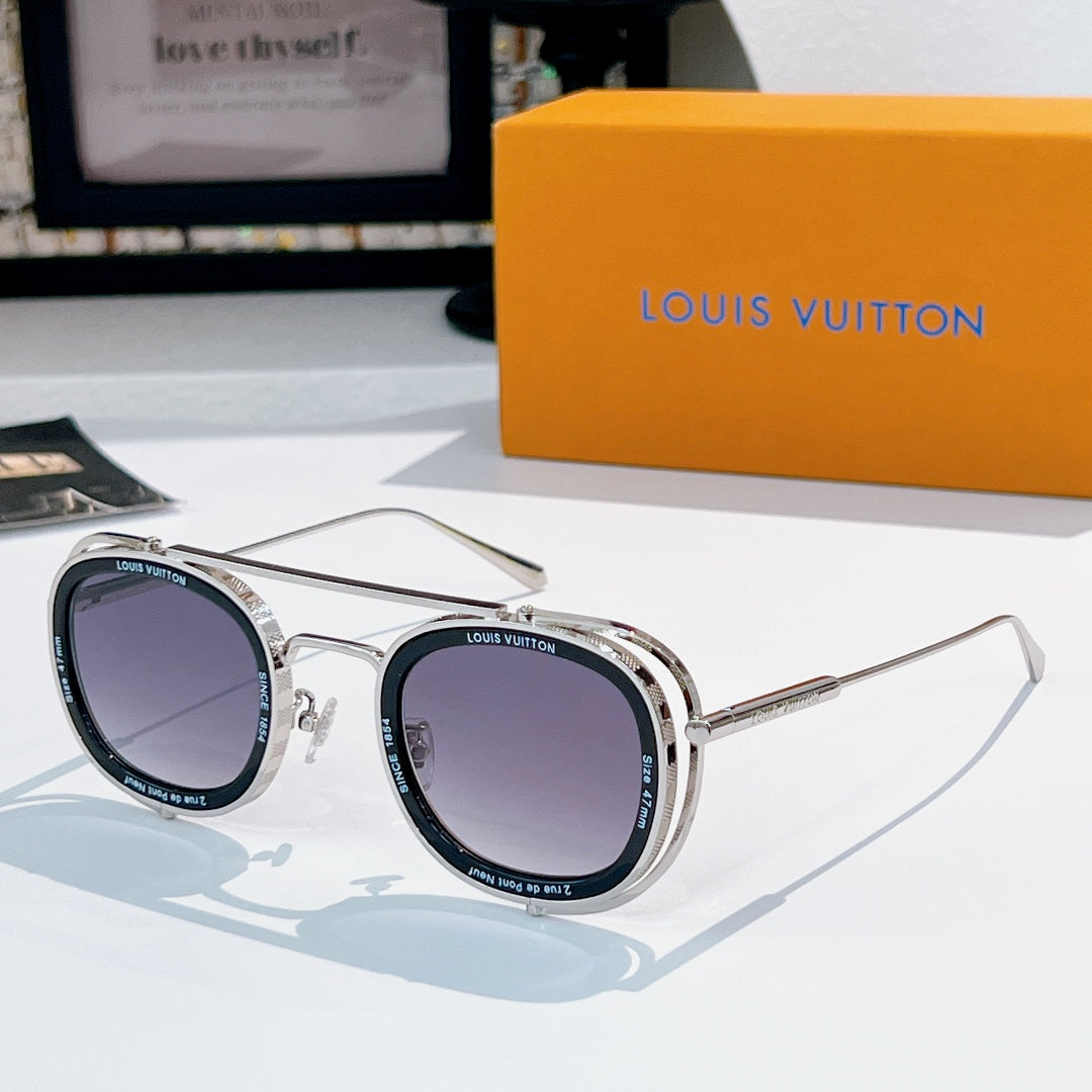 Louis Vuitton round sunglasses, silver frames with dark purple lenses.
