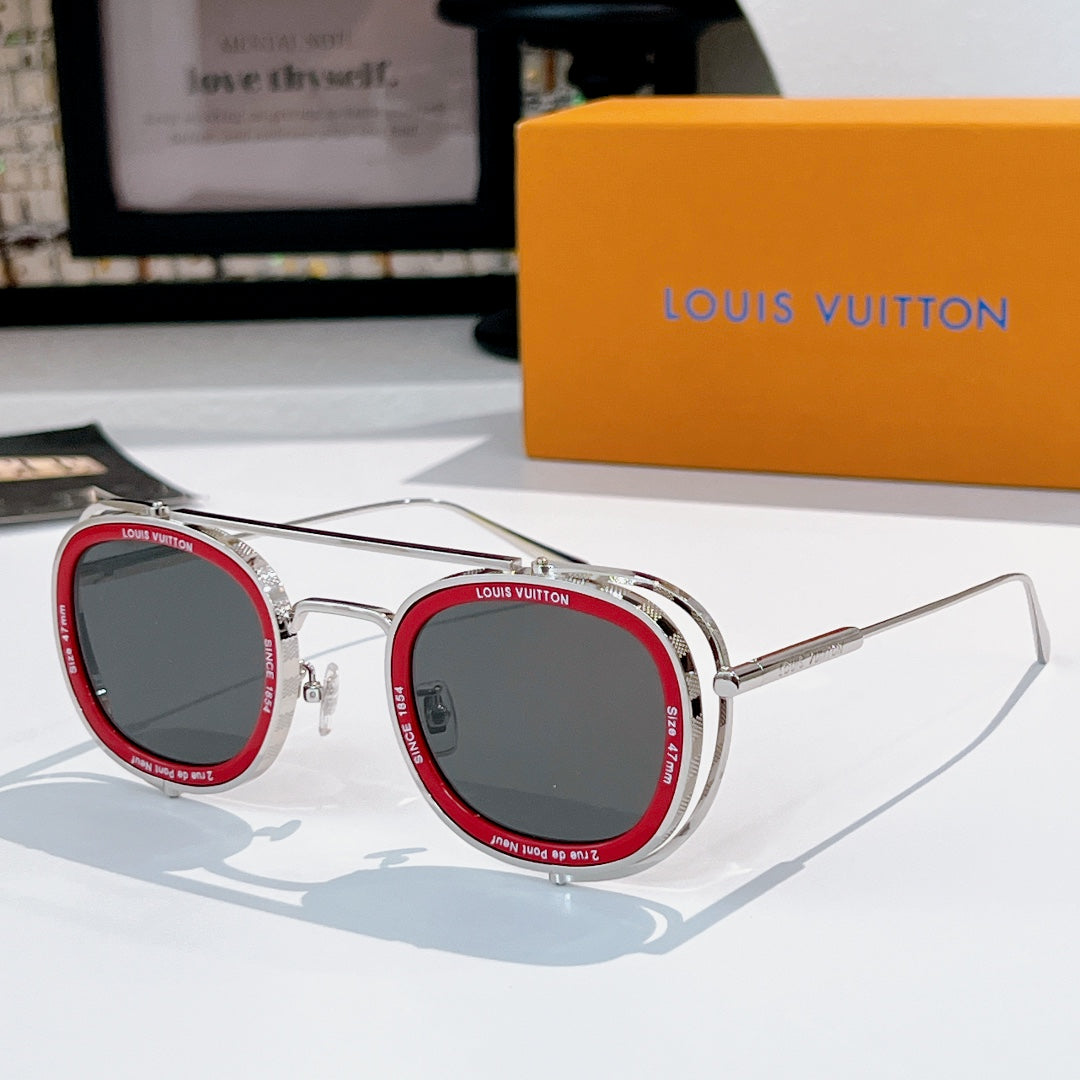 Louis Vuitton round sunglasses, silver frames with red accents and dark lenses.