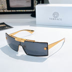 Versace sunglasses with dark tinted lenses and gold frames