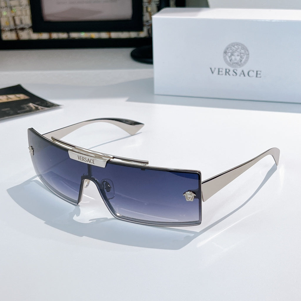 Versace sunglasses with dark blue tinted lenses and dark frames
