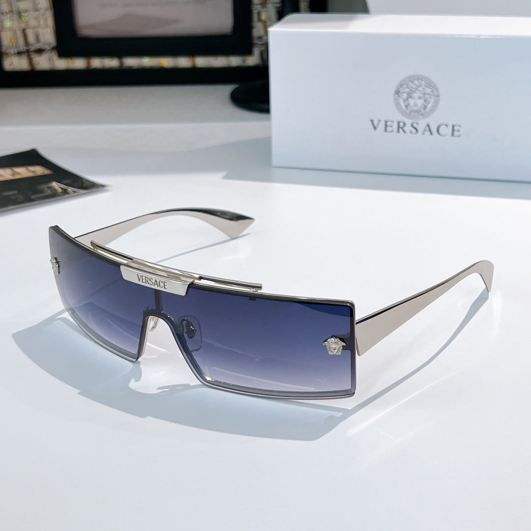 Versace sunglasses with dark blue tinted lenses and dark frames