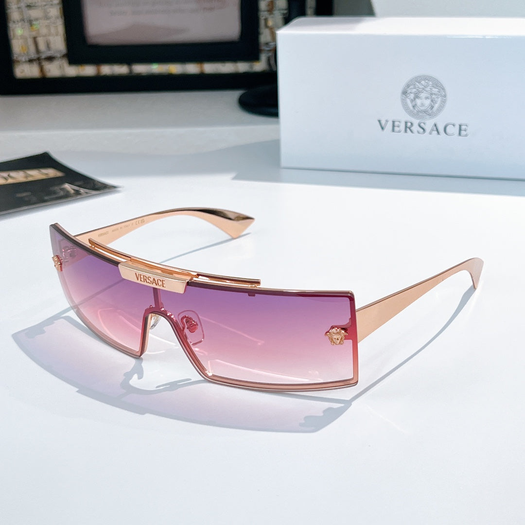 Versace sunglasses with rose tinted lenses and light pink frames