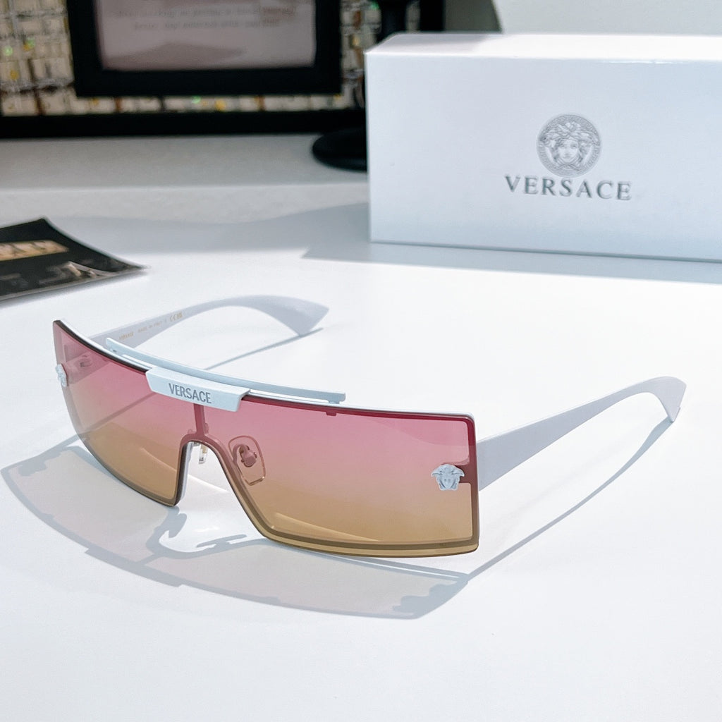 Versace sunglasses with pink tinted lenses and light frames