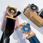 Versace sunglasses temple close-up with gold detailing and colored emblem panels