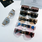 Versace sunglasses assortment with mixed frames and lens colors, shown with branded temple details