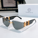Versace sunglasses with gold frame, gray gradient lenses, and Medusa emblem on temples