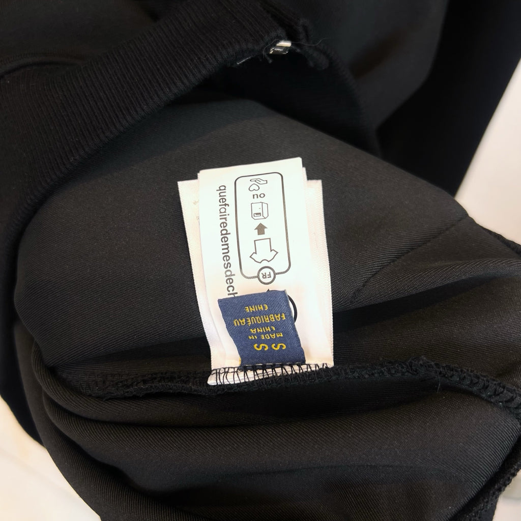 Dark hoodie fabric and size care label inside collar area