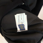 Dark hoodie fabric and size care label inside collar area