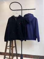 Zip-up hoodie pair in black and navy, both with red polo logo