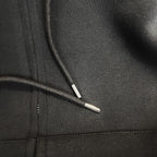 Zip-up hoodie close-up showing zipper track and metal zipper pull