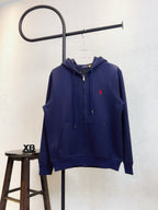 Navy zip-up hoodie with adjustable hood and red polo logo