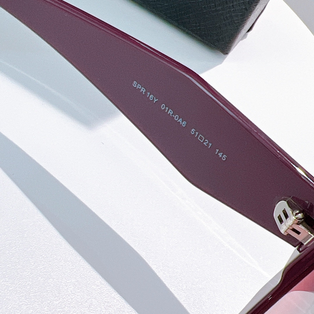 Burgundy sunglass temple with printed model and size markings