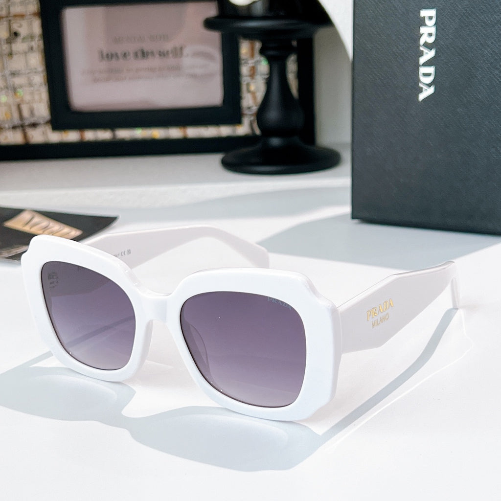 White sunglasses with lavender-tinted lenses and gold-tone logo on the temple