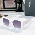 White sunglasses with lavender-tinted lenses and gold-tone logo on the temple