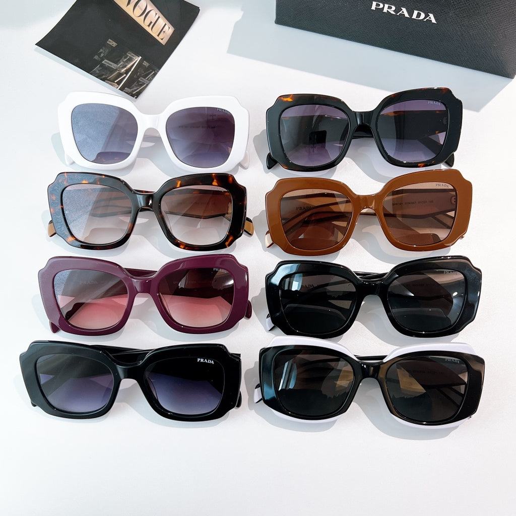 Assorted Prada sunglasses with colored frames and tinted lenses, shown together