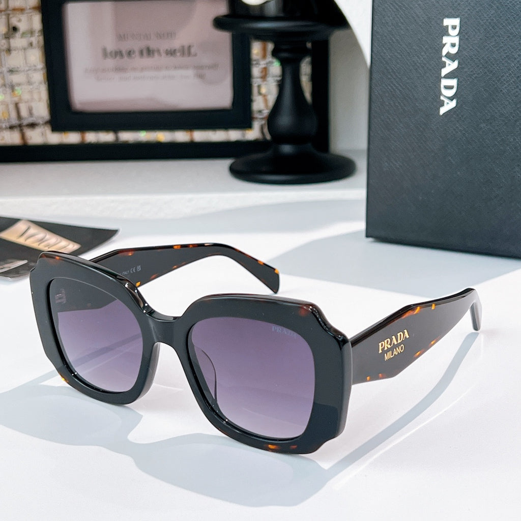 Black sunglasses with purple-tinted lenses and orange tortoise-style accents
