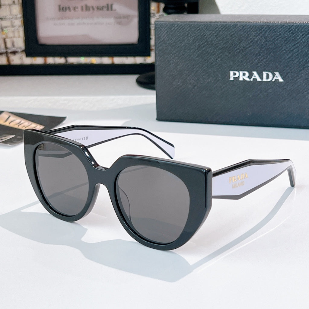 Prada sunglasses with dark frames and gray tinted lenses.