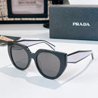 Prada sunglasses with dark frames and gray tinted lenses.