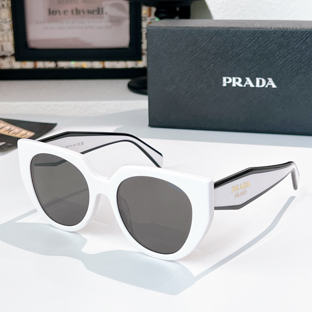 Prada sunglasses with white frames and dark tinted lenses.