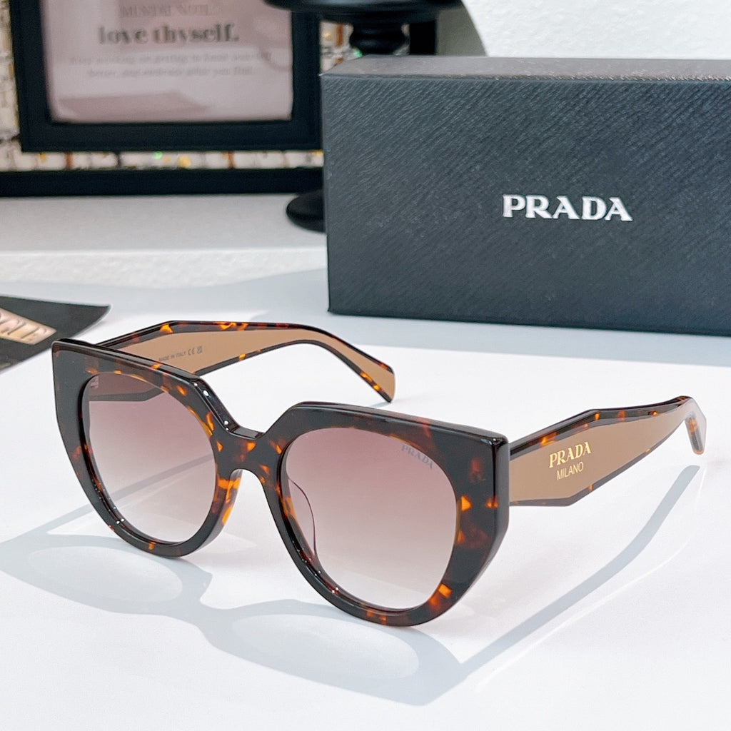 Prada sunglasses with tortoiseshell and black frames, tinted lenses.