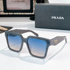 Blue square sunglasses with blue tinted lenses and Prada logo on temple.