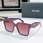 Burgundy square sunglasses with pink tinted lenses and Prada logo on temple.
