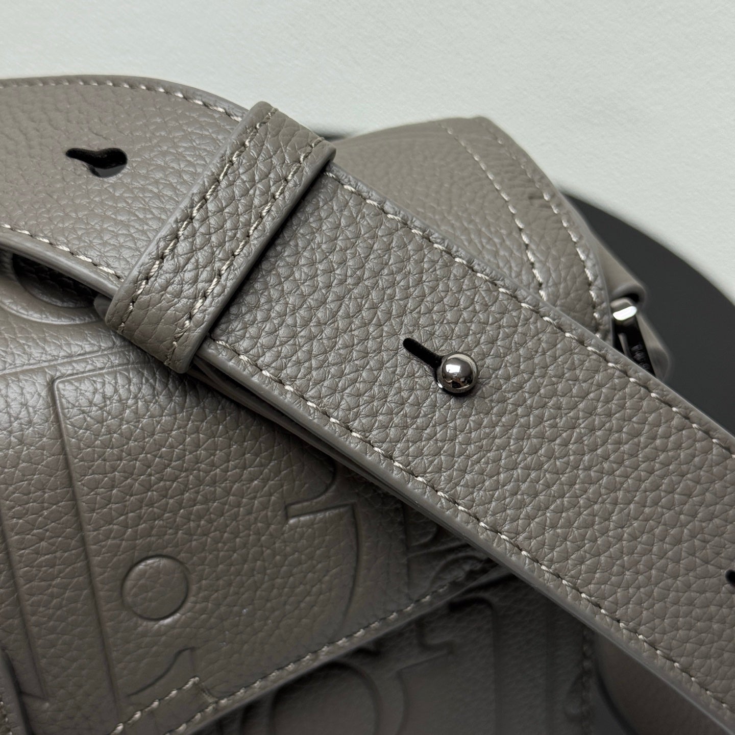 Dior bag adjustable strap with snap buttons and pebble-grain leather