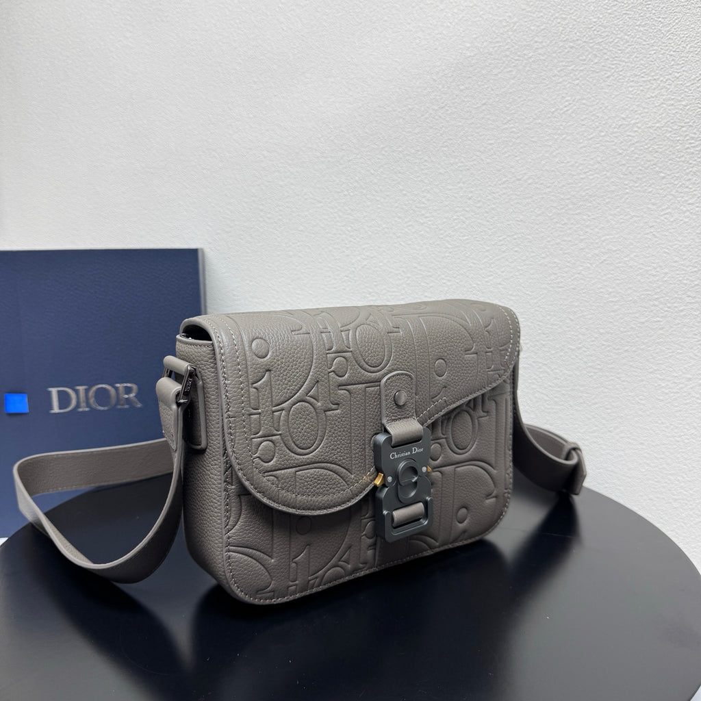 Dior embossed crossbody bag with flap and adjustable shoulder strap