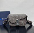 Dior embossed shoulder bag with flap, top buckle clasp, and adjustable crossbody strap