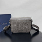 Dior embossed shoulder bag with structured flap and side straps