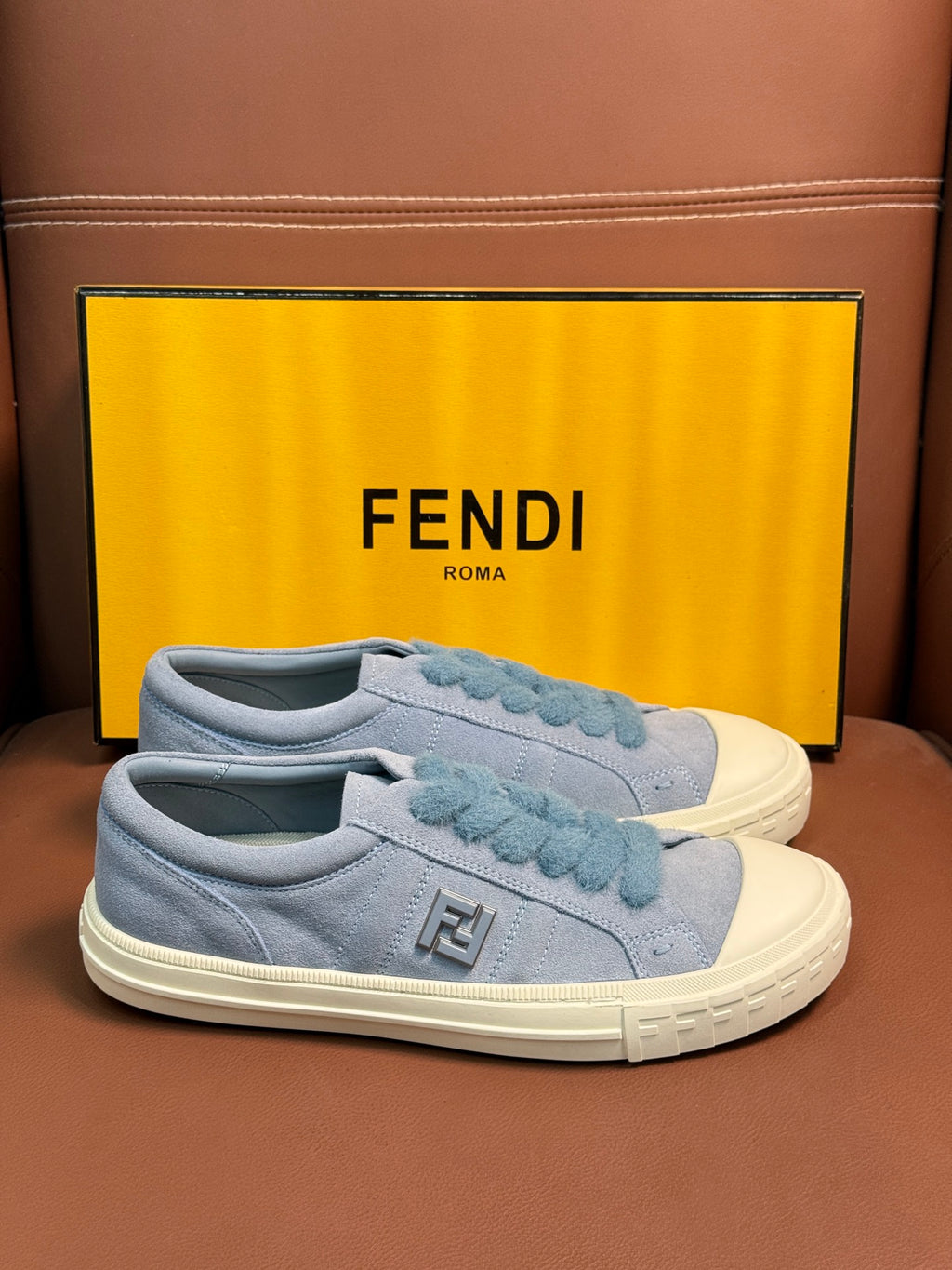 Fendi unisex light-blue slip-on sneakers with ruffled lace panel and white rubber sole
