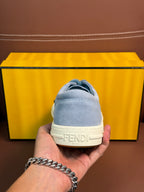 Fendi unisex light-blue sneakers heel close-up with FENDI logo on the back tab