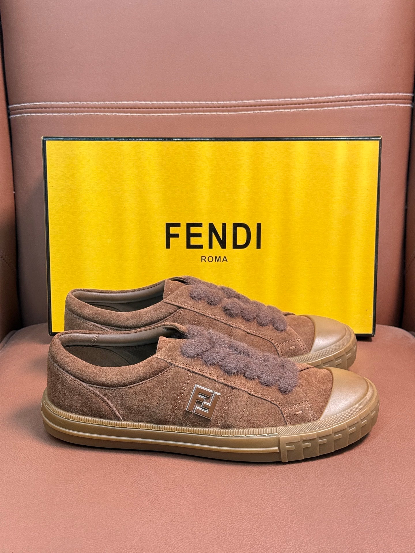 Fendi unisex suede sneakers, front view with lace-up and FF logo on tongue