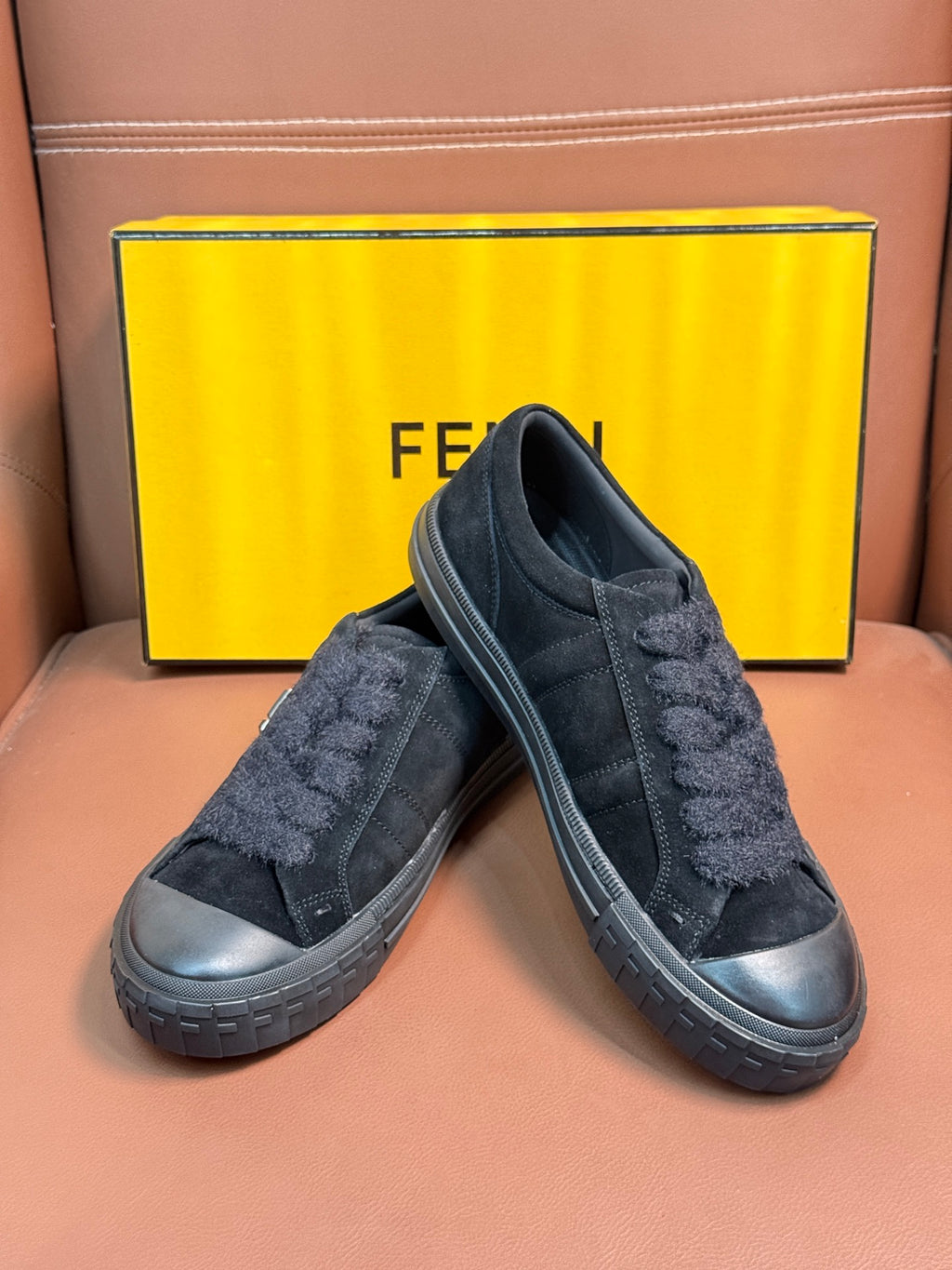 Fendi unisex slip-on sneakers in dark suede with side logo and ridged sole