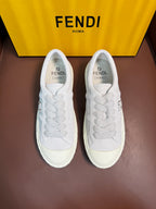 White Fendi unisex sneakers, side-by-side view with lace-up design and logo patch