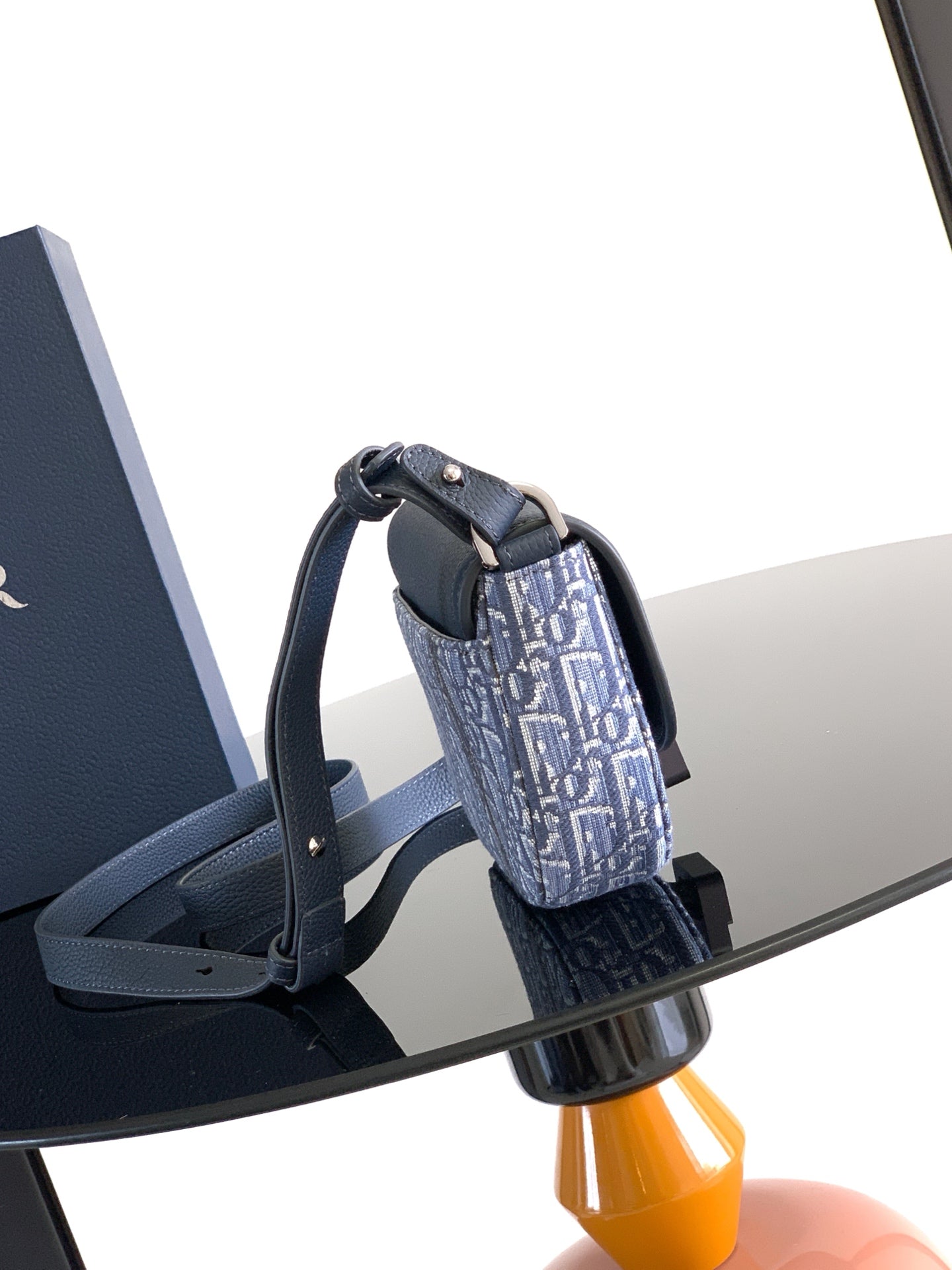 Dior crossbody bag with curved handle and blue monogram fabric