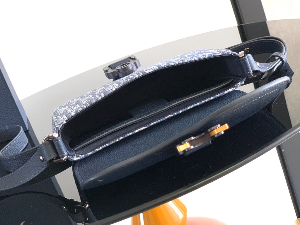 Dior crossbody bag with open top and navy leather interior