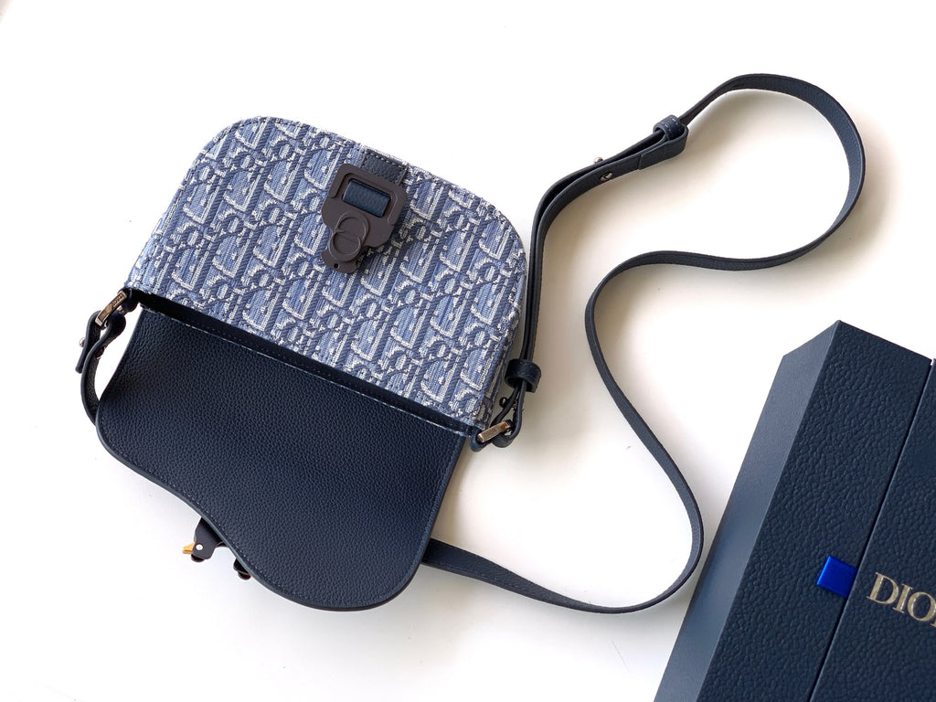 Dior crossbody bag with navy flap, blue monogram body, adjustable strap