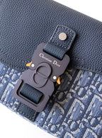 Dior bag charm on textured navy leather with blue monogram panel