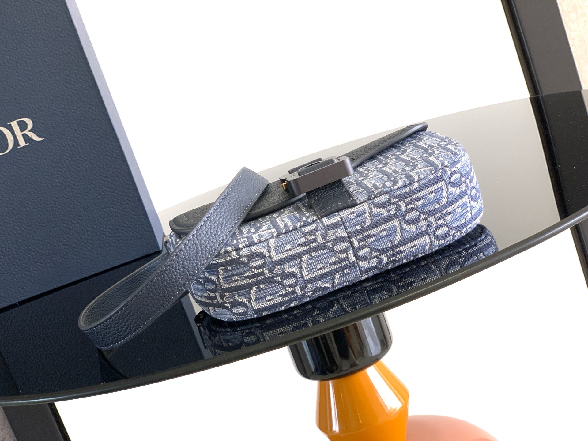 Dior crossbody bag with blue monogram fabric and navy leather flap